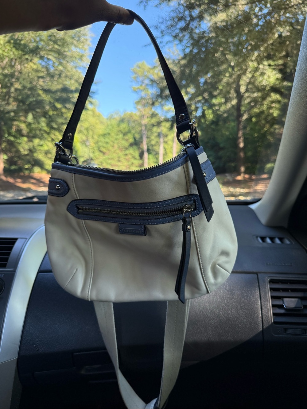 Coach Cream Shoulder Bag with Navy Blue Trim and Zipper Accent.